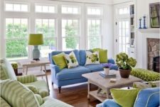 04 shades of green and blue in this living room are complemented with white and beige for a cozy feel