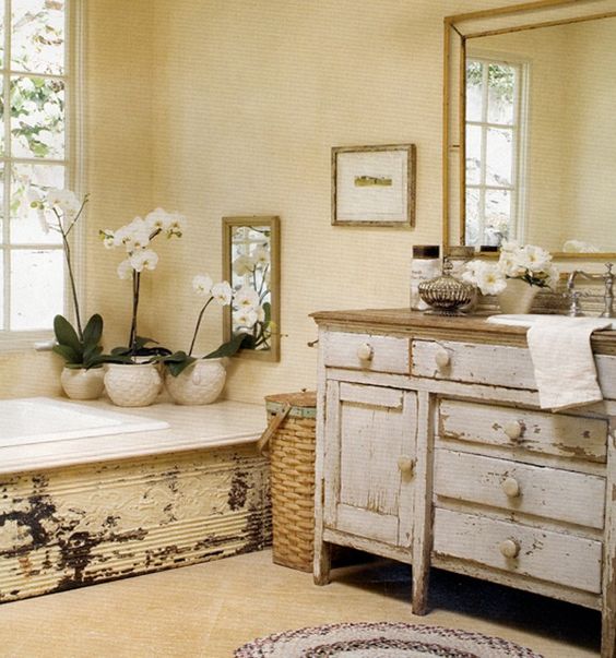 worn shabby chic bathroom vanity with a natural wood counter