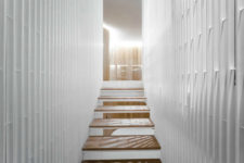 06 Staircase structure is filled with light thanks to its design, and I like the contrasting look of white and warm woods