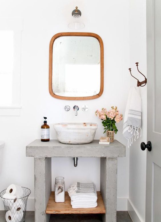 concrete and wood bathroom vanity with an open shelf