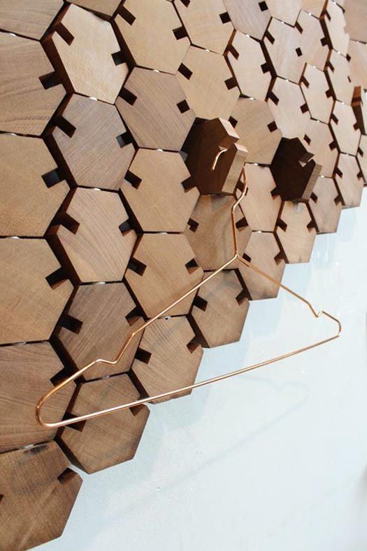 unique wooden honeycomb tiles that are functional and can be used for hanging and holding