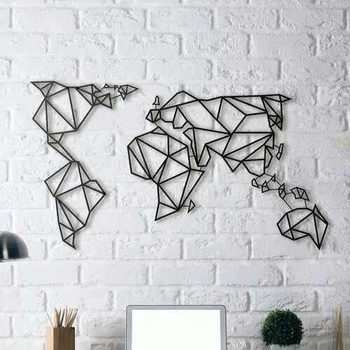 White brick wall with black graphic map of the world as a wall art.
