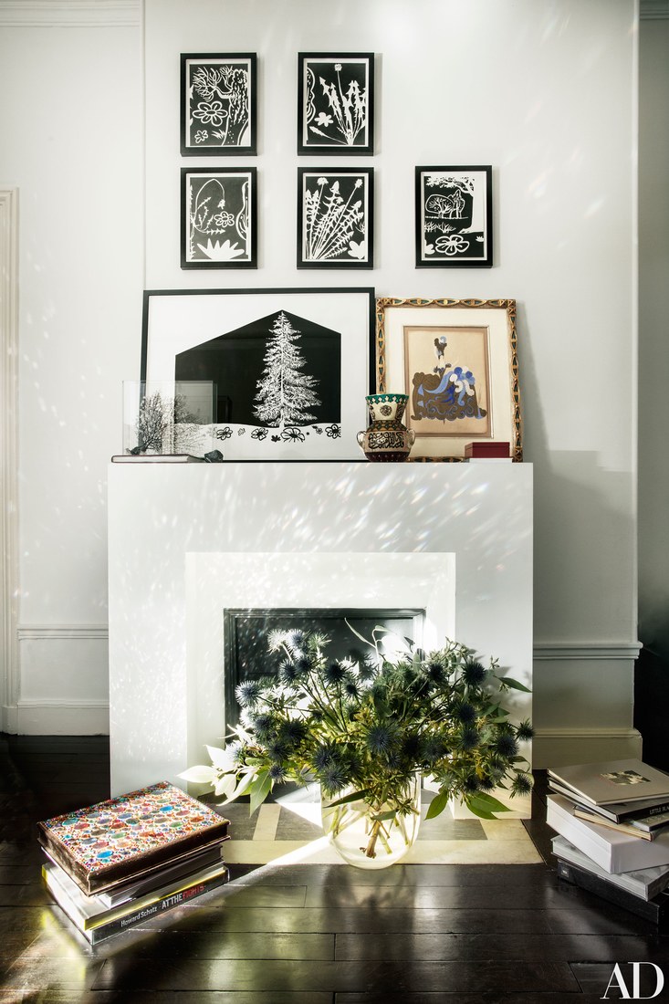 The fireplace as used for displaying the artworks mostly and I love thistles instead of flowers