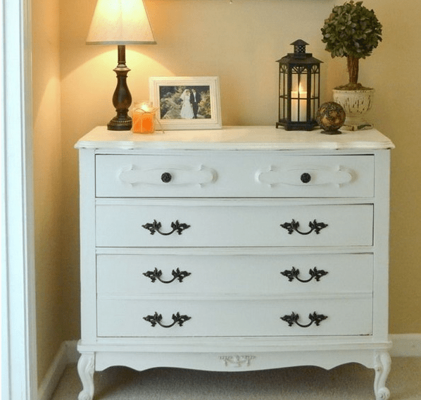 chic white dresser in vintage style, dark handles