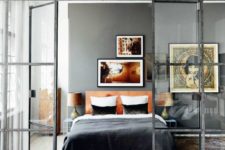 08 French doors with a modern look in black frames to separate the bedroom from the rest of the apartment