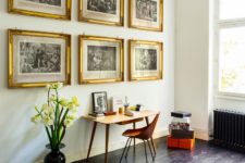 08 The master bedorom shows beautiful artworks in shining gold frames and small desk with a bent wood chair