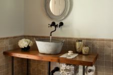 08 a galvanized bathroom sink on a wooden countertop with black pipe legs