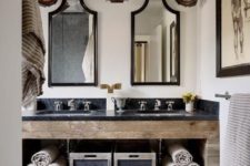 09 a stone and reclaimed wood vanity with open shelving inside