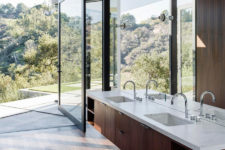 10 bathroom opened to outdoors, warm dark woods and a mirror wall to capture even more views