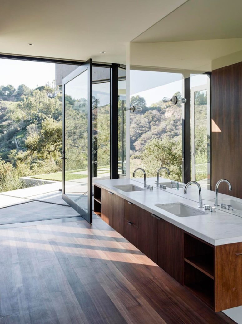 bathroom opened to outdoors, warm dark woods and a mirror wall to capture even more views