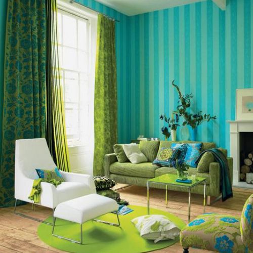 lime green, turquoise and blue living room with a crispy white chair