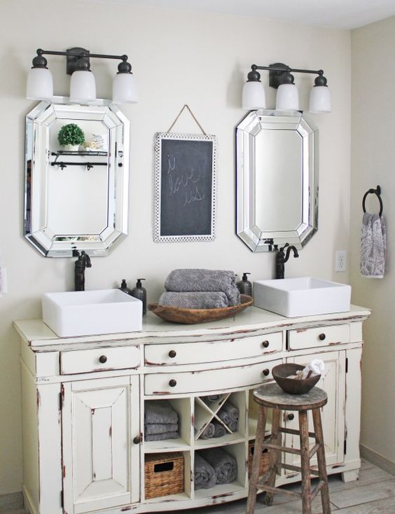 vintage cream-colored bathroom vanity with a worn look