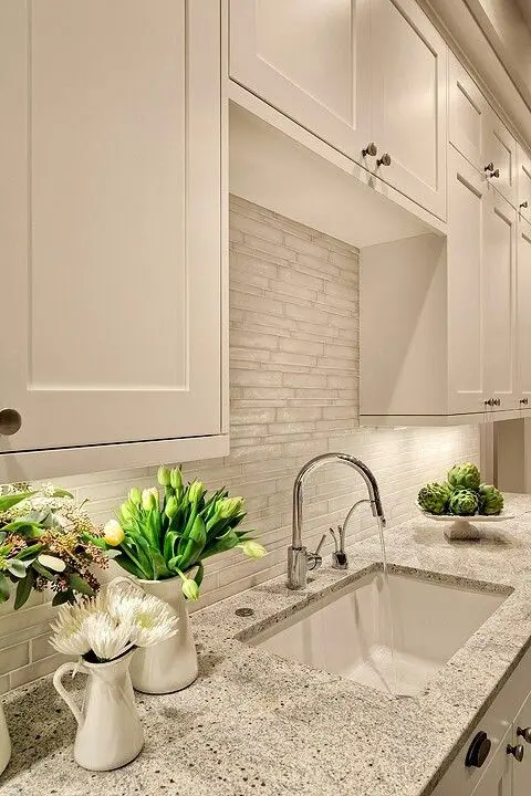 white cabinets look great with such stone-inspired grey countertops
