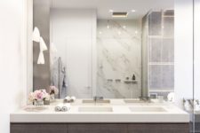 11 modern bathroom with dark woods, white marble and a mirror wall