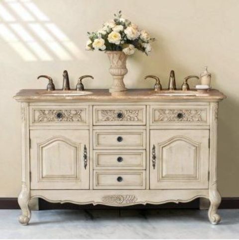 an old buffet from a flea market was painted white and repurposed into a vanity