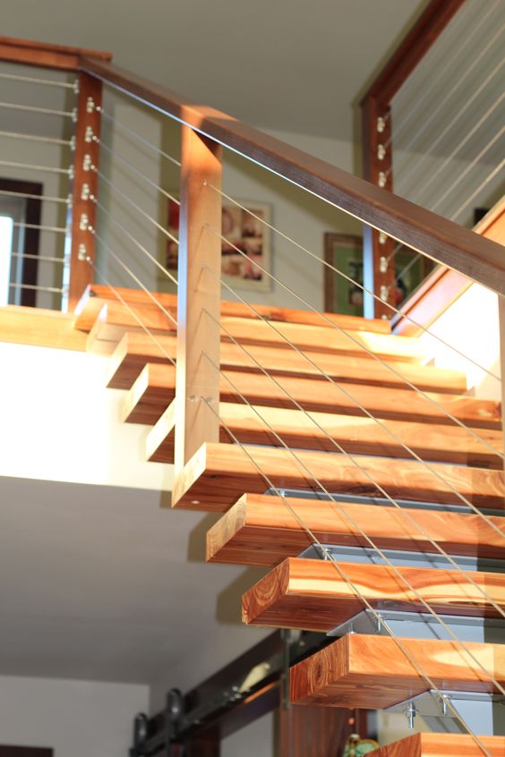 Combine the modern sleek look of cable railing with a wood and stainless steel baluster for a fully customized look