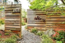 13 rustic wooden fence made of reclaimed wood and placed strategically to cover what’s necessary