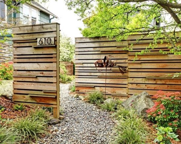 rustic wooden fence made of reclaimed wood and placed strategically to cover what's necessary