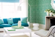 13 vibrant damask wallpaper and bold blue upholstery complemented with whites