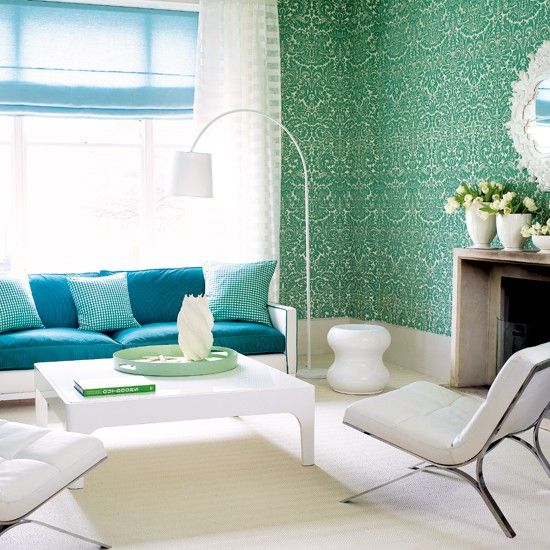 vibrant damask wallpaper and bold blue upholstery complemented with whites