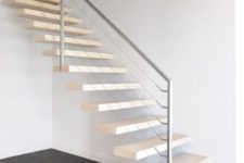 14 light-colored floating stairs with metal and cable railing