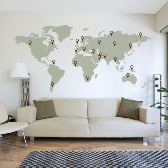 Make your living room more inspiring with a world map and point your trips on it.