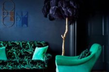 15 emerald upholstery and a navy wall for a moody yet bold living room