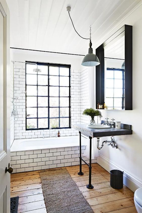 reclaimed wood and black pipes countertop for a chic industrial bathroom