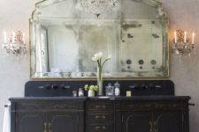 15 refined black vanity with gold contours and a large mirror