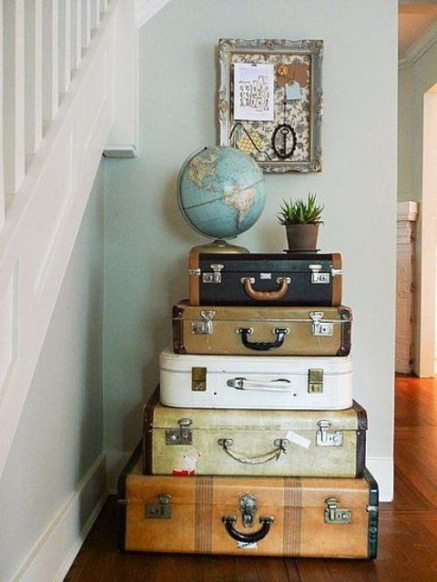 Vintage suitcases stacked in your entryway can be not only a source of inspiration but also creative storage.