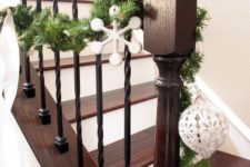 15 wrought iron spindles, dark stain and white trim