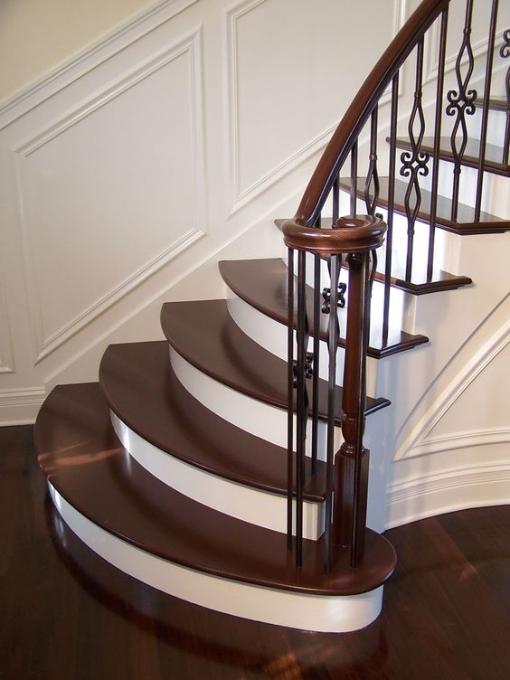 gorgeous wrought iron balluster stairs with painted treads and risers
