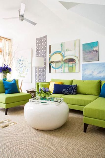 lime green upholstery, blue and navy pillows and art works