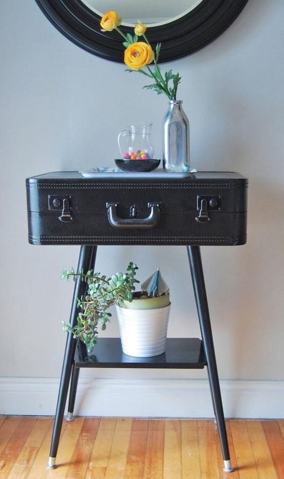 vintage suitcase turned into a console table for an entryway looks cool