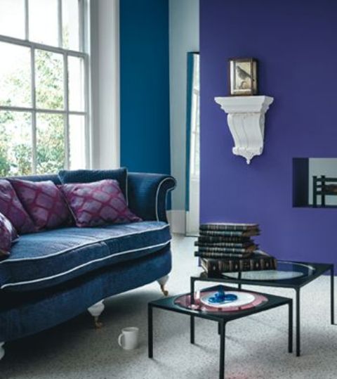a violet and a teal wall, a teal sofa for a colf refined living room