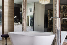 19 a mirror wall and an additional one in a refined frame to give the bathroom a gorgeous look