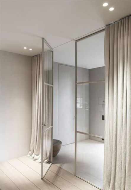beige metal framing doors look ethereal and can be covered with curtains for privacy