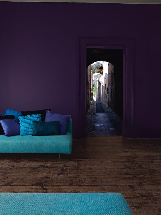 deep purple walls will make the space moody and bright turquoise accessories will enliven it