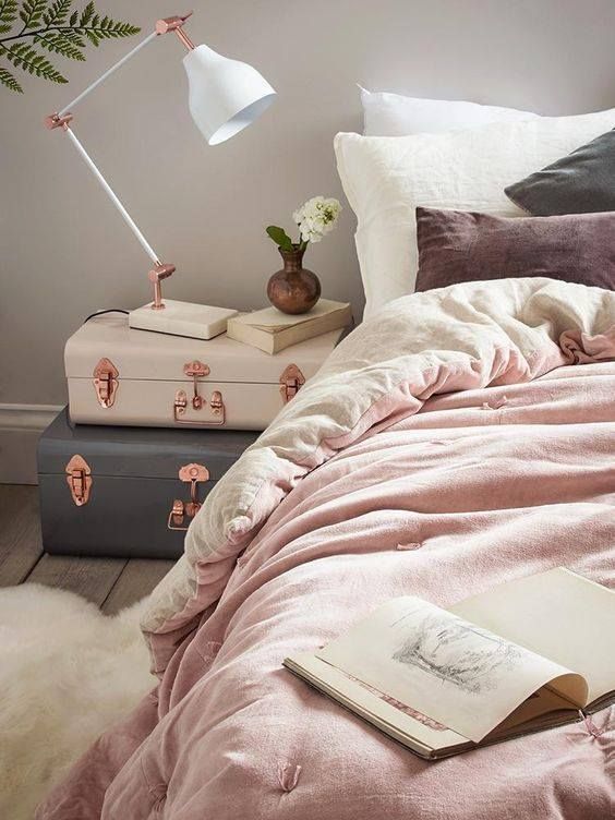 feminine bedroom with two suitcase stacked for a bedside table, they look so dreamy and inspiring