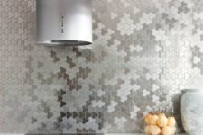 19 unique stainless steel puzzle wall covering instead of a kitchen backsplash