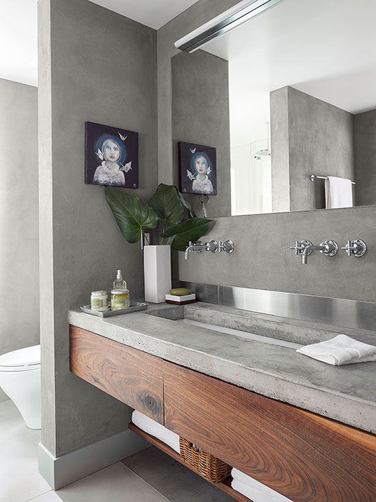 a wooden vanity with a concrete countertop for a modern laconic bathroom