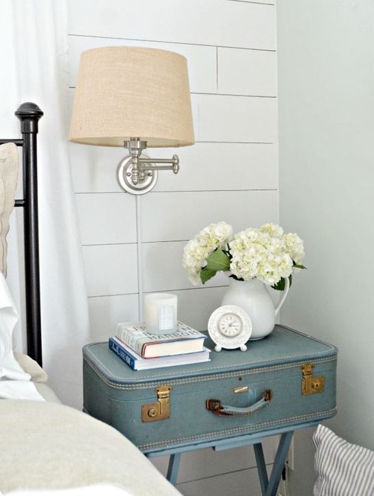 Rustic bedroom decor with a vintage suitcase nightstand.