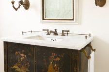 21 adorable vintage vanity with painted images, an open shelf and a marble counter