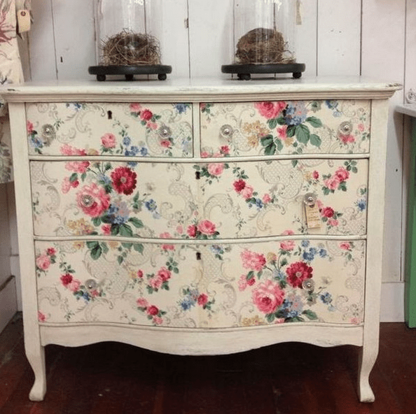 a dresser renovated with floral wallpaper is an easy DIY project