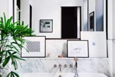 22 chic modern marble bathroom with a free-standing bathtub and a framed mirror