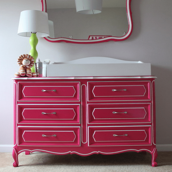 a dresser renovated with bold pink paint and new handles