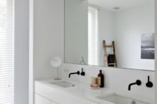 24 ultra-minimalist white bathroom with a mirror niche to accentuate the sink area