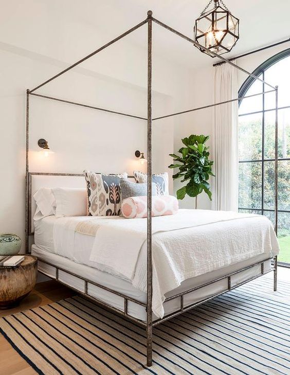 vintage-loooking bed with a frame of rusty metal for a bold statement
