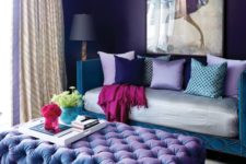 24 violet and teal glam living room with a unique chandelier and a crazy artwork