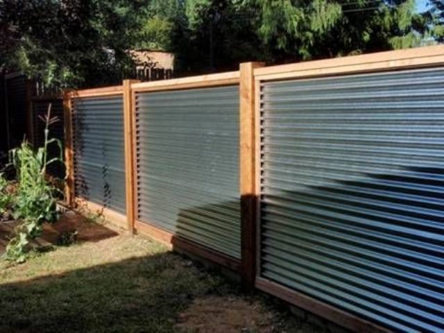 Warm colored wood and corrugated metal for a privacy fence